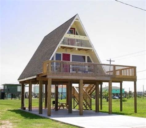 black metal a frame house on stilts|hoisting houses on stilts.